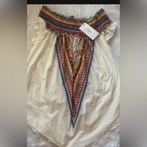 Colorful Blouse with gathered neck line. Short sleeve and light material